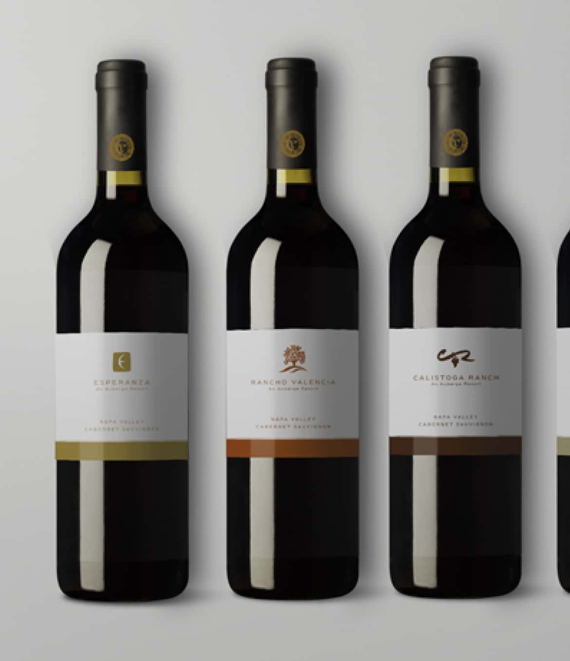 Three identical bottles of 'Calistoga Ranch Cabernet Sauvignon' wine lined up, each with a label showing the resort logo and vineyard details.
